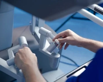 Close-up of a surgeon performing surgery utilizing a robotic system